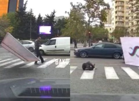 Bakıda külək küçə lövhəsini vətəndaşın üzərinə aşırdı – VİDEO