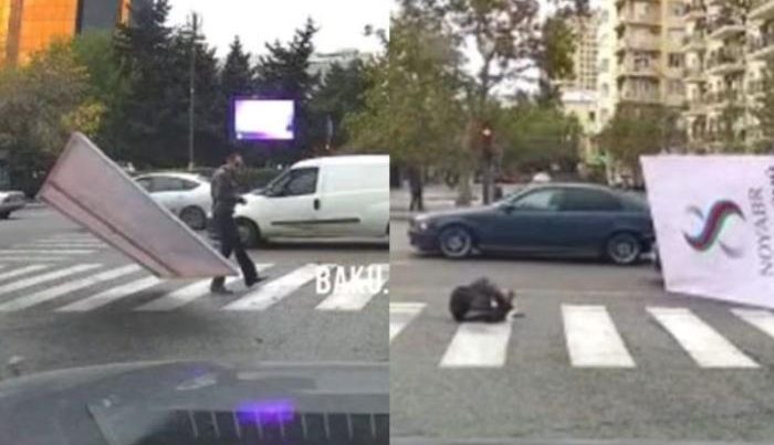 Bakıda külək küçə lövhəsini vətəndaşın üzərinə aşırdı – VİDEO Bakıda külək küçə lövhəsini vətəndaşın üzərinə aşırdı – VİDEO